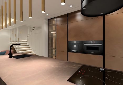 Kuchnia z półwyspem w brązach z blatem ze spieku.