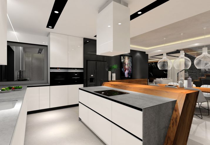 Aranżacja nowoczesnej białej kuchni z szarym blatem oraz elementami z forniru z orzecha.