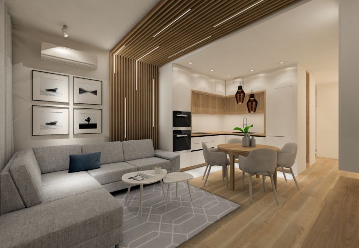 Aranżacja małego salonu z aneksem kuchennym w stylu skandynawskim.