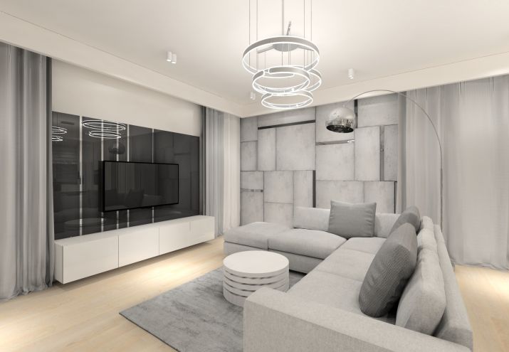 Nowoczesna aranżacja salonu składa się z wygodnej sofy oraz strefy telewizyjnej.