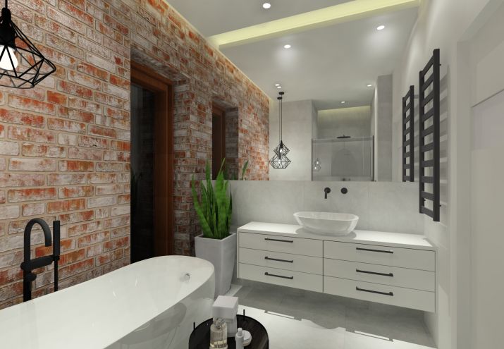 Projekt łazienki z cegłą na ścianie oraz wanną wolnostojącą.
