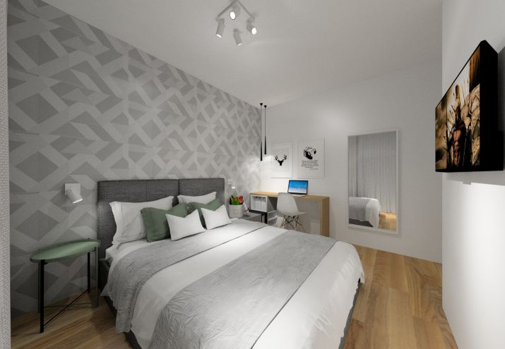 Sypialnia z szarą tapetą i łóżkiem tapicerowanym