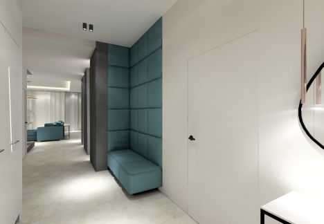 W holu umieszczono wykonane na zamówienie przez tapicera, siedzisko z panelami tapicerowanymi.